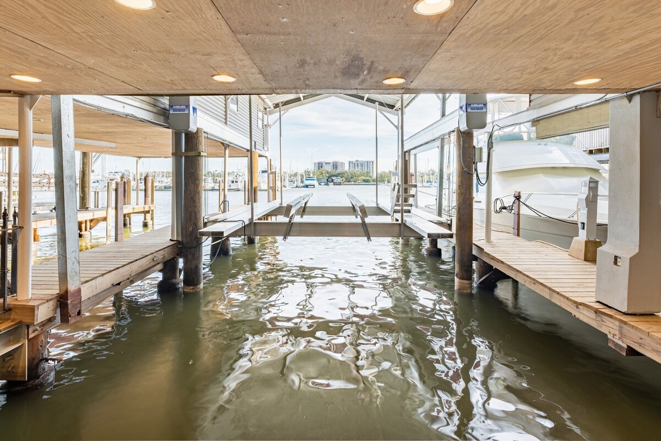 Ground level featuring water-access, built-in bar, and multiple lounging spaces.