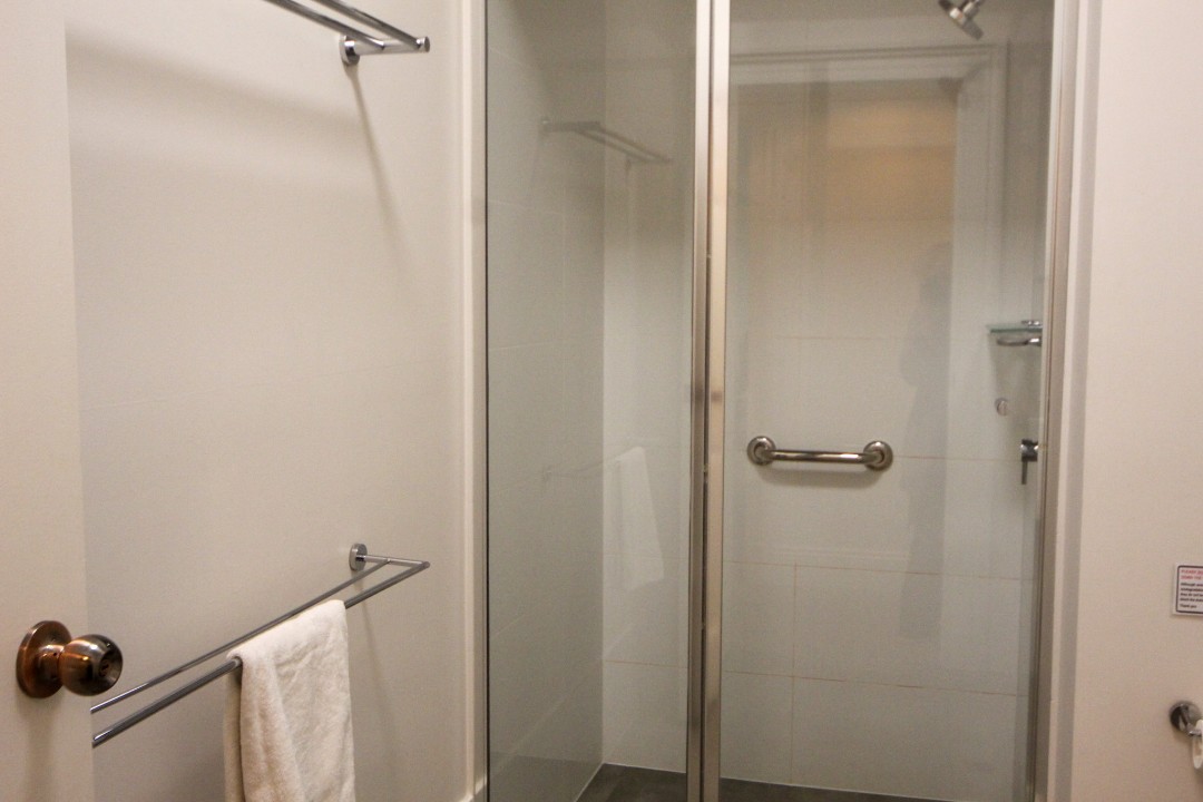 Open plan lounge, dining, and kitchen areas with smart TV, free WiFi, split system air conditioning, modern kitchens, and refurbished bathrooms in each unit featuring contemporary fixtures for guest comfort.