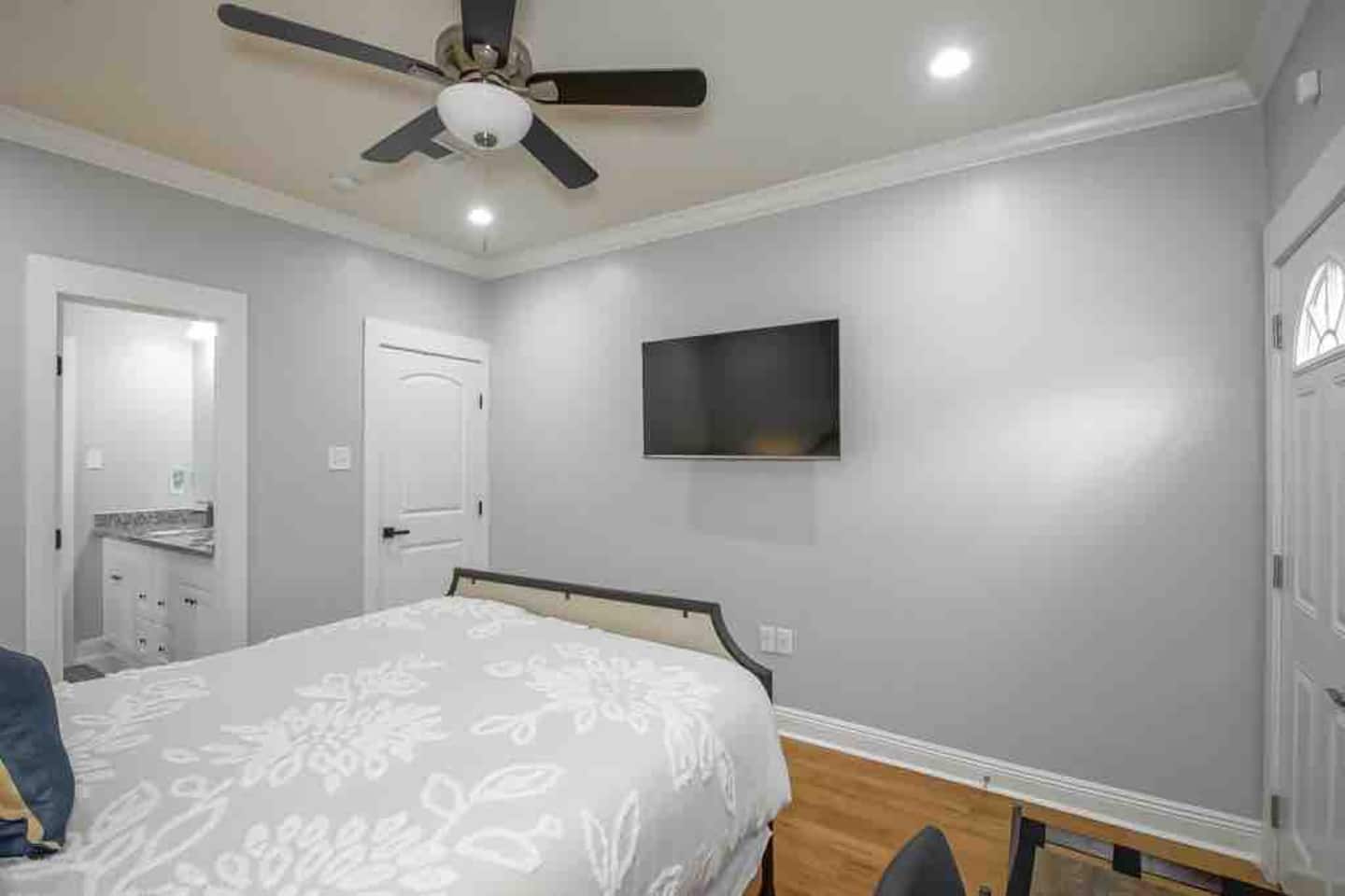 Master bathroom with in suite bathroom, workstation, luggage rack, closet organization, smart tv