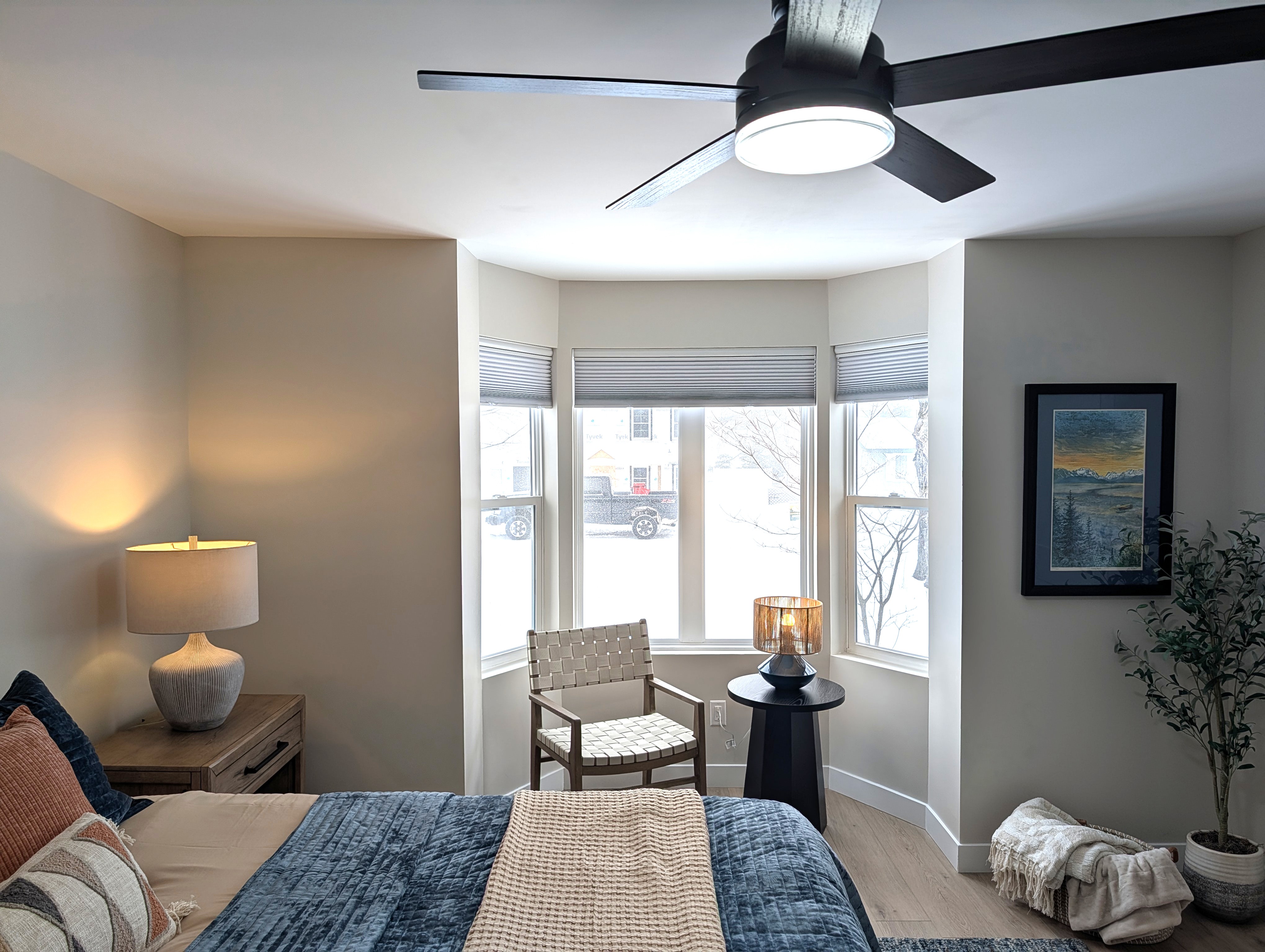 BEDROOM #1 (PRIMARY BEDROOM, MAIN FLOOR):  This is large and beautiful bed featuring a king-size bed, private ensuite full bathroom, private television, dresser, chair, ceiling fan, and closet.