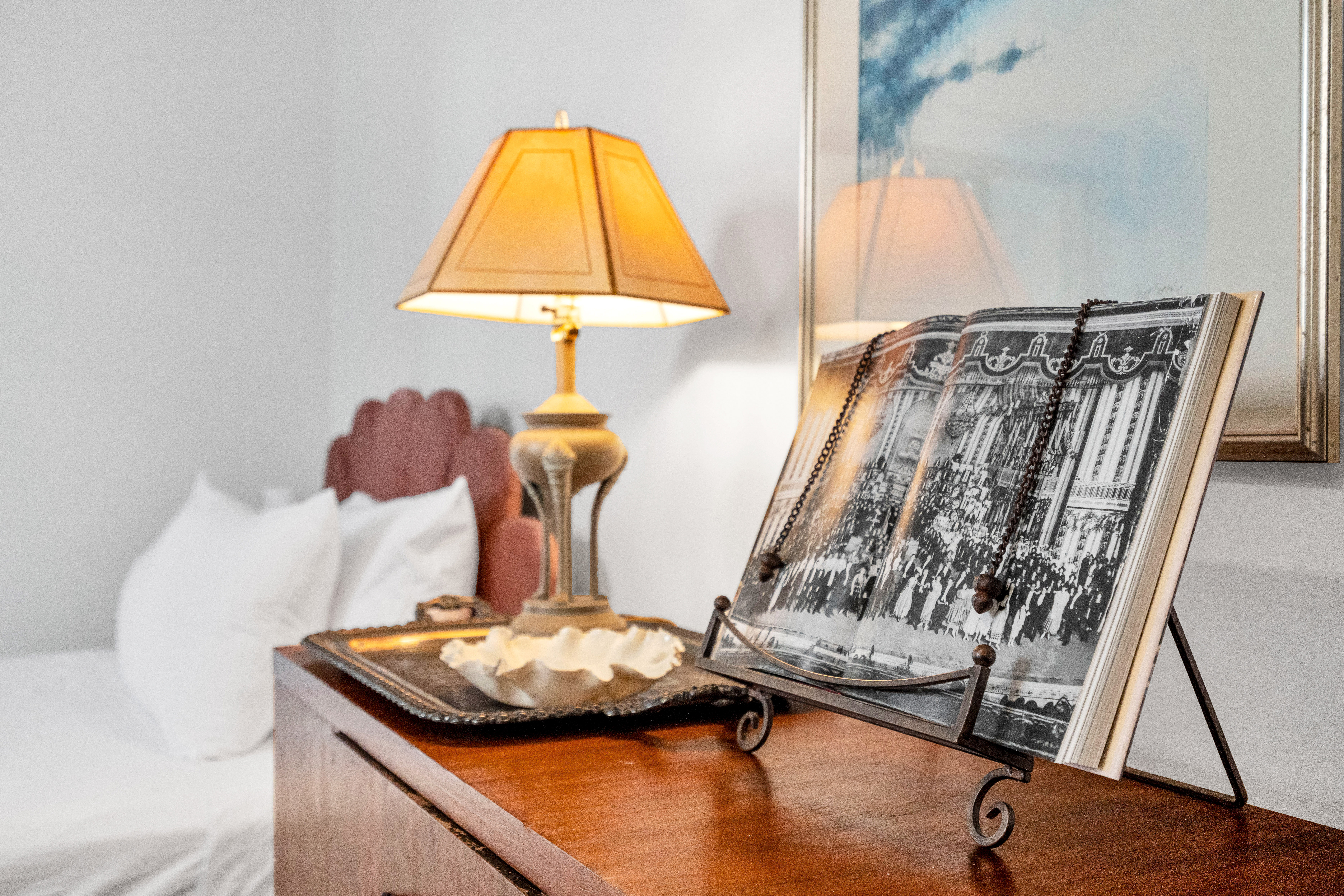 Bedside table with lamp and curated books