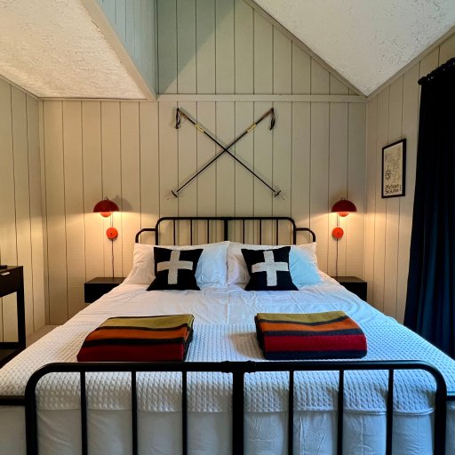 Michigan Winter Room — King bed, wool blankets, and vintage ski posters