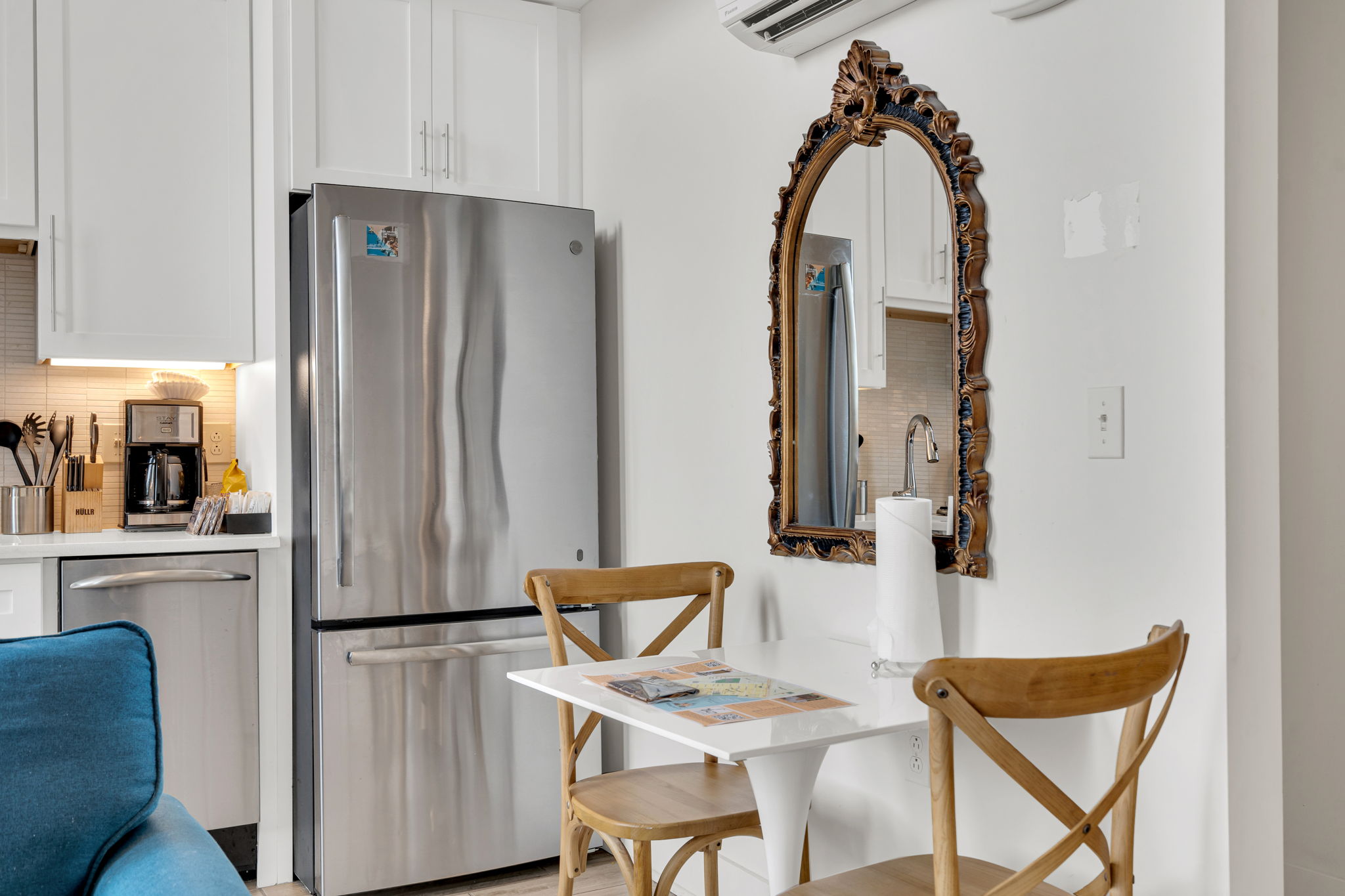 Charming dining nook with vintage flair—perfect for a cozy meal or planning your day in the city. (unit 1)