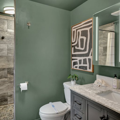Spacious primary ensuite with updated finishes and modern tile.