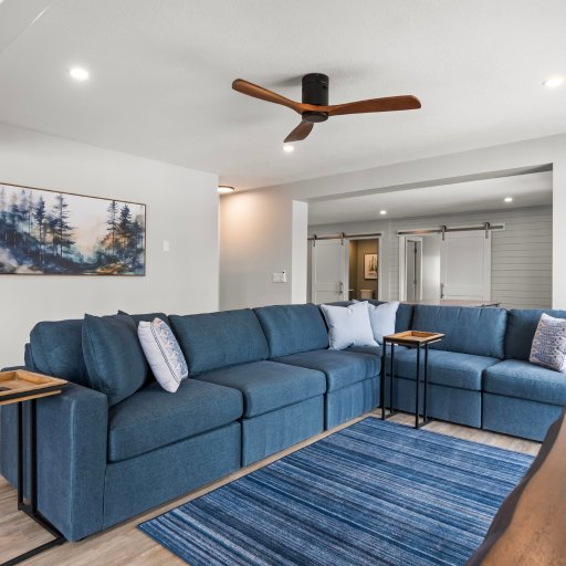 Cozy up on the oversized sectional — barn door to master suite