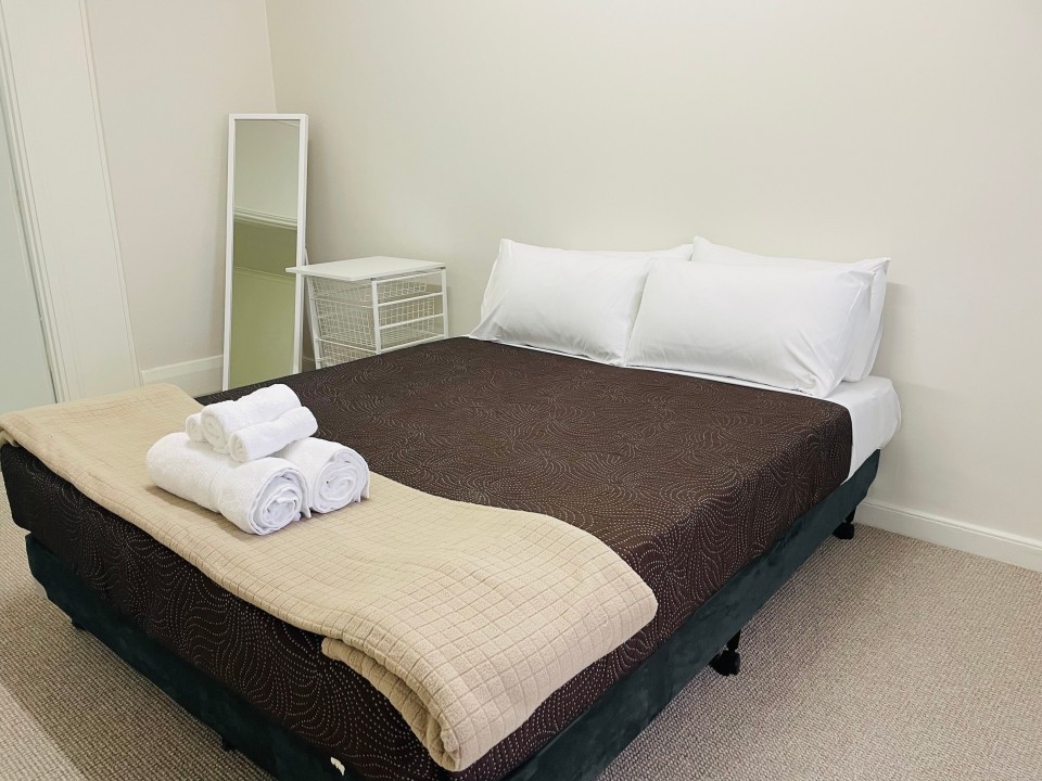 Configured with a Queen-size bed in the master bedroom and a fold-out couch in the living area, accommodating up to 4 guests comfortably.
