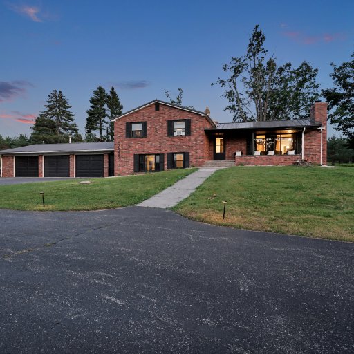 Exterior view of the home set on expansive grounds.