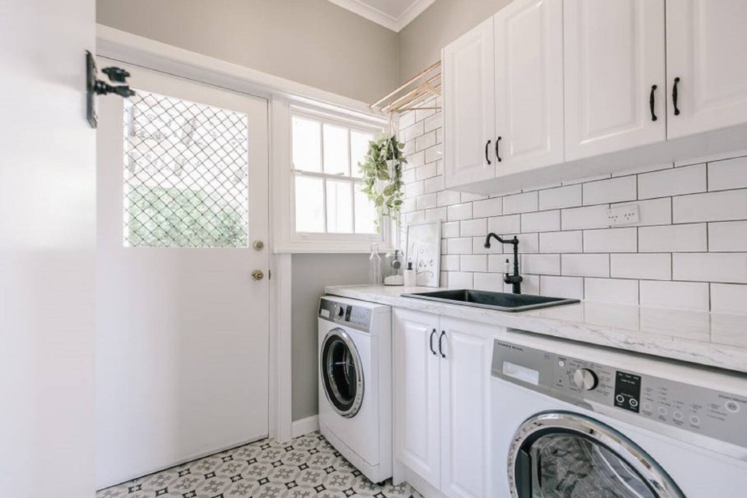 Modern laundry facilities including washing machine and dryer for guest convenience.