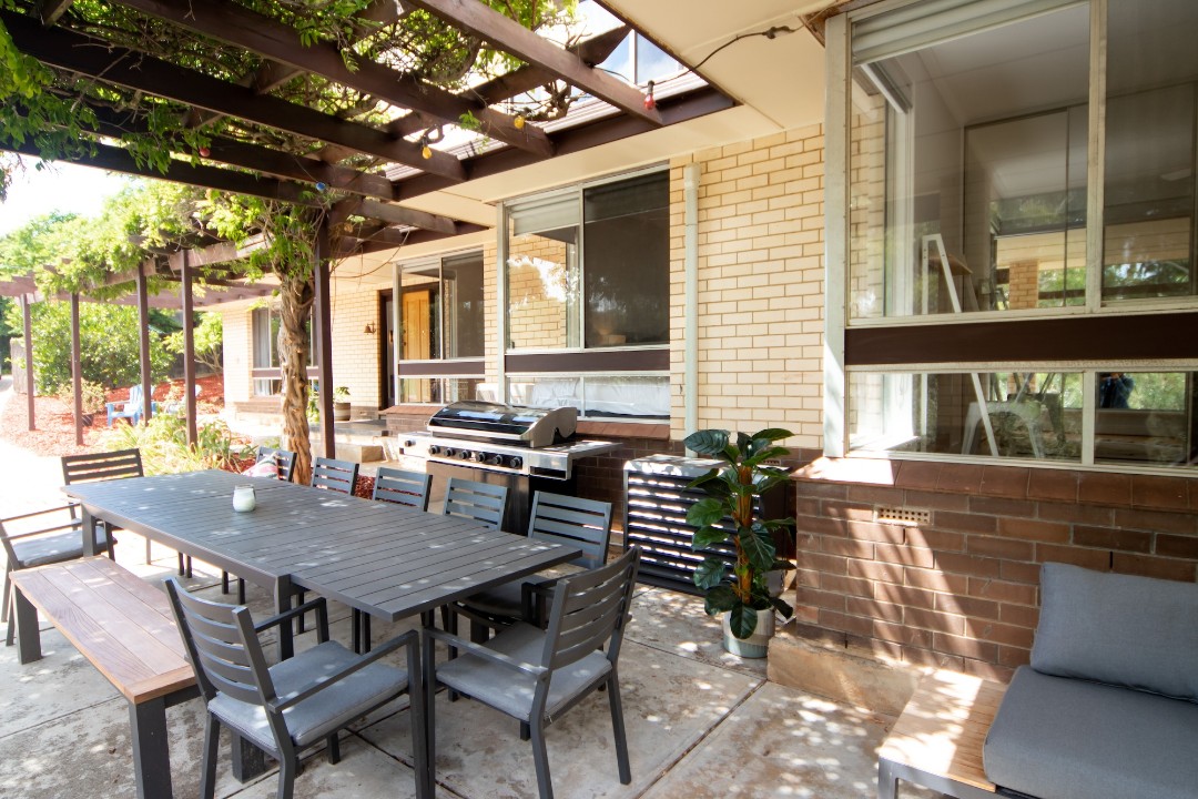 Alfresco Entertaining Area with BBQ Grill
Outdoor dining overlooking the pool and park reserve – ideal for relaxed afternoon barbecues and casual family meals.