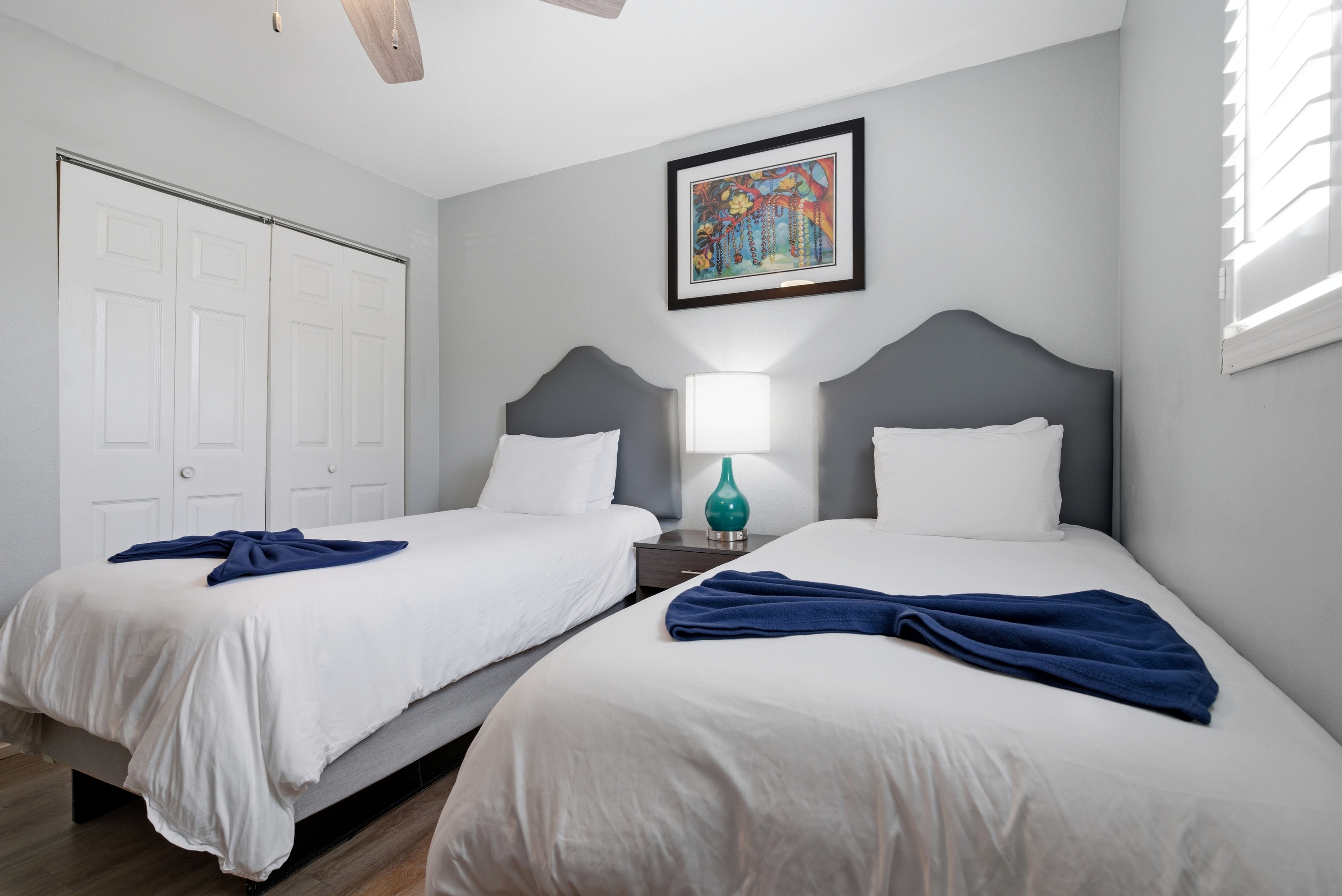 Secondary bedroom with cozy twin beds with calming tones