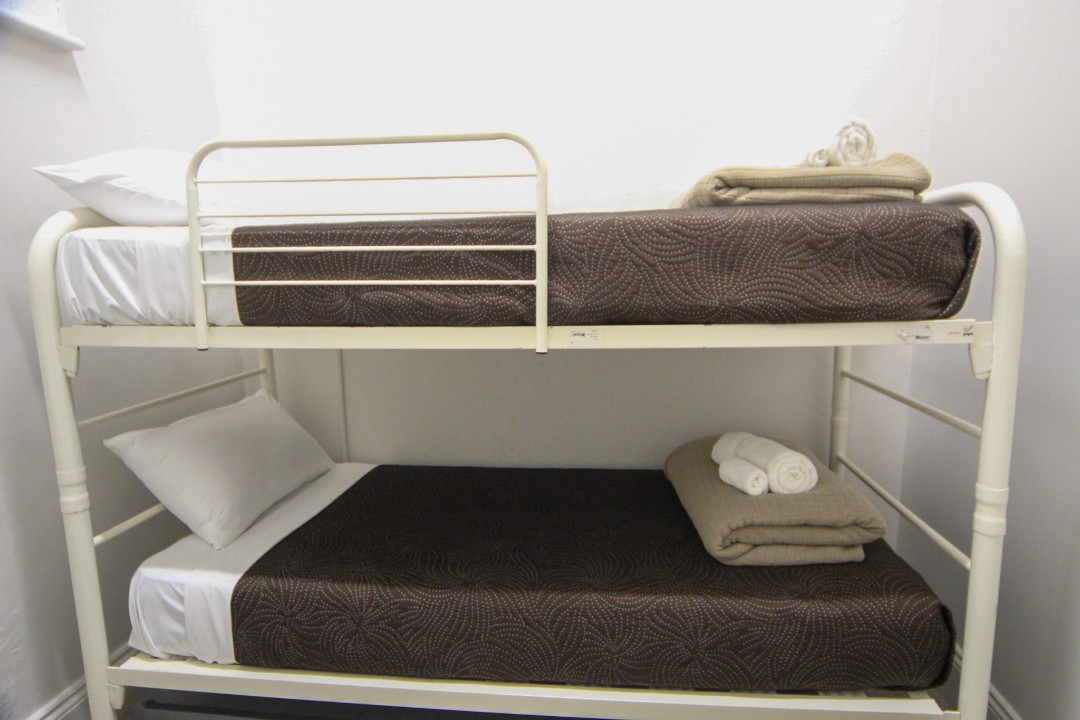 Bedding includes queen bed and two bunk beds (no beach view, no balcony for this unit).