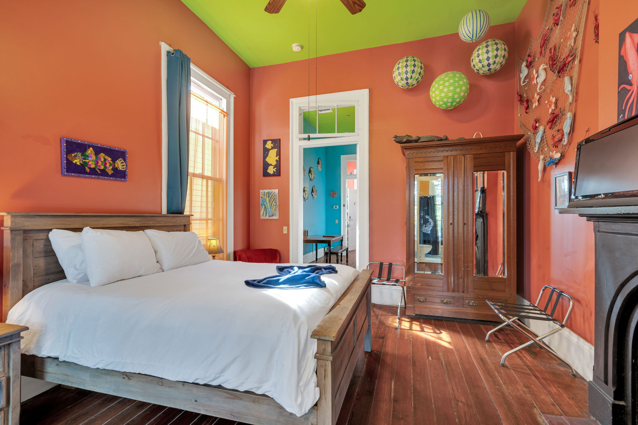 Spacious, art-filled bedroom with authentic New Orleans flair.