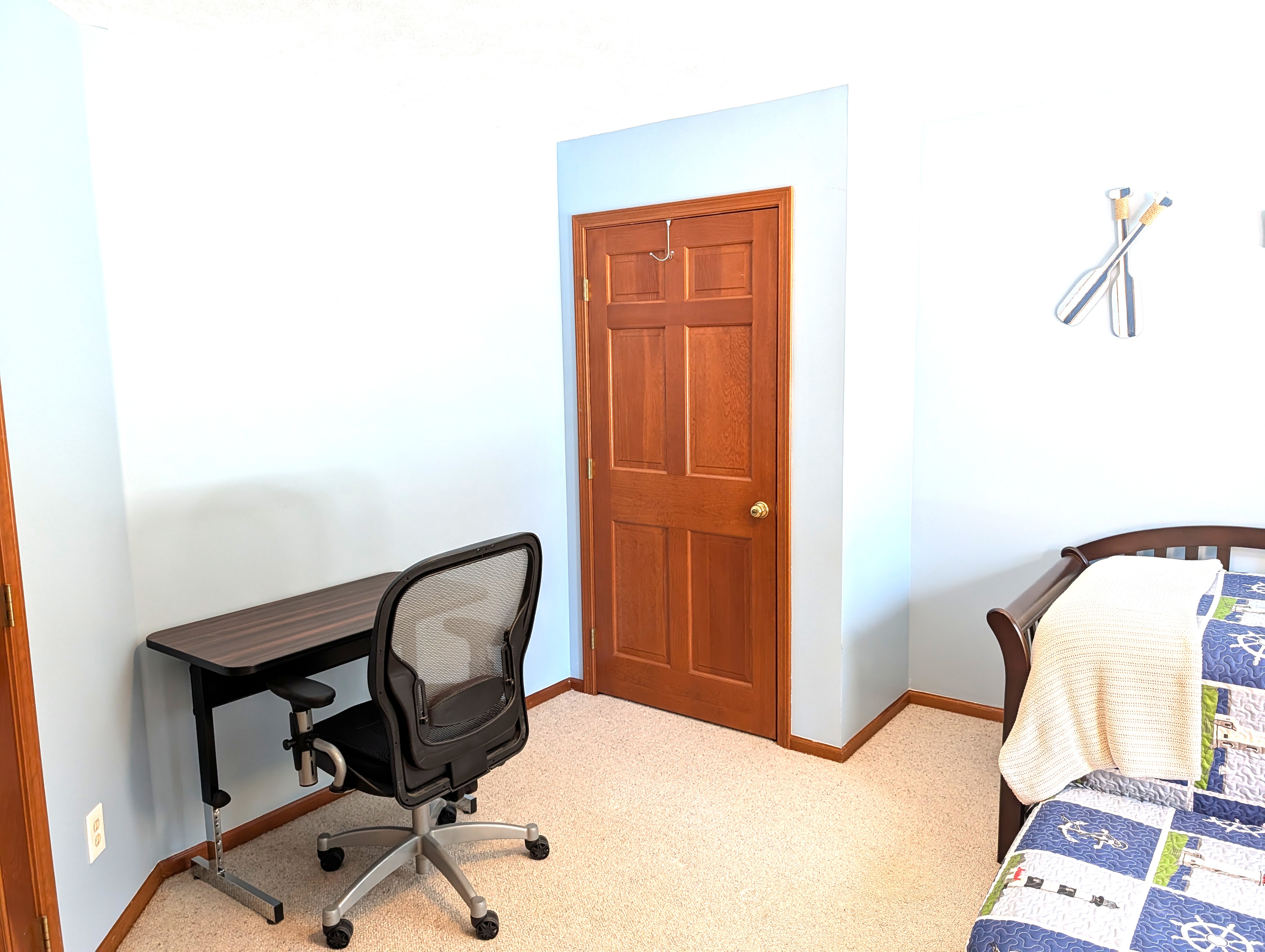 BEDROOM #1 (FIRST FLOOR):  There is a small bedroom with a trundle bed on the first floor.  Includes a closet, dresser, and mirror as well.