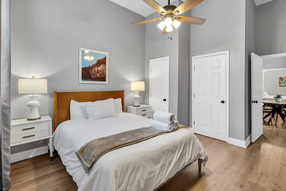 The bedroom offers a peaceful escape with a plush queen bed, soft linens, and calming decor, perfect for unwinding after a day in the city. Simple, stylish, and super comfortable