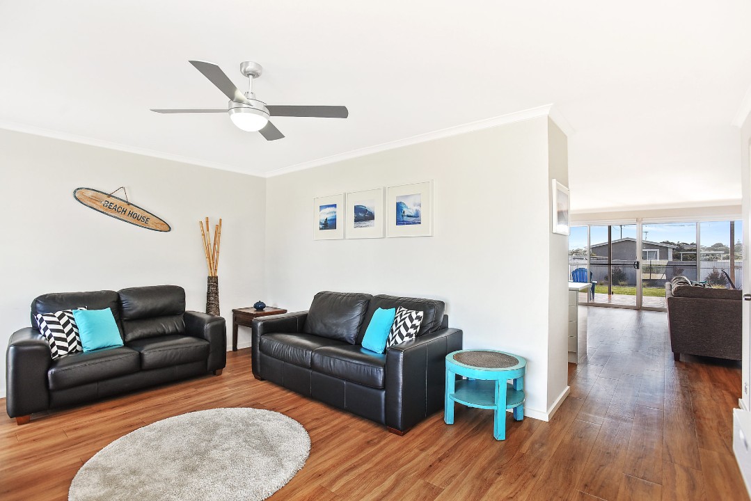 Two flat-screen TVs, DVD player, stereo system with connectivity, microwave, coffee pod machine, and additional household conveniences.