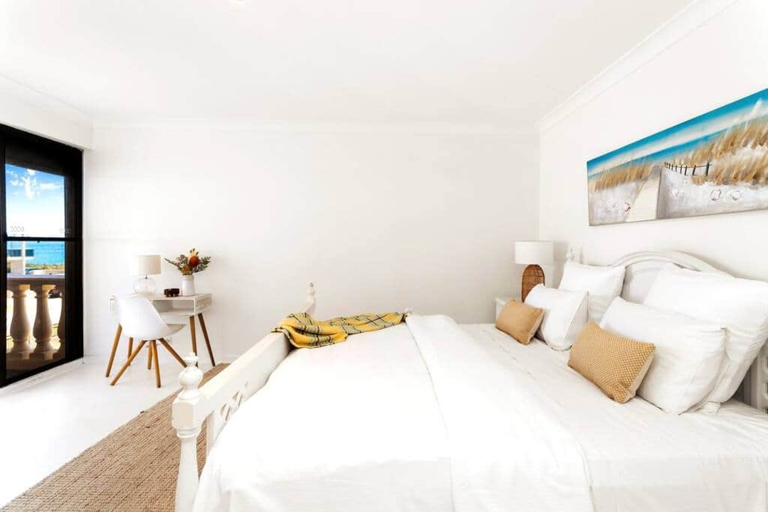 Comfortable upstairs King bed ocean views, balcony access. Blockout blinds.