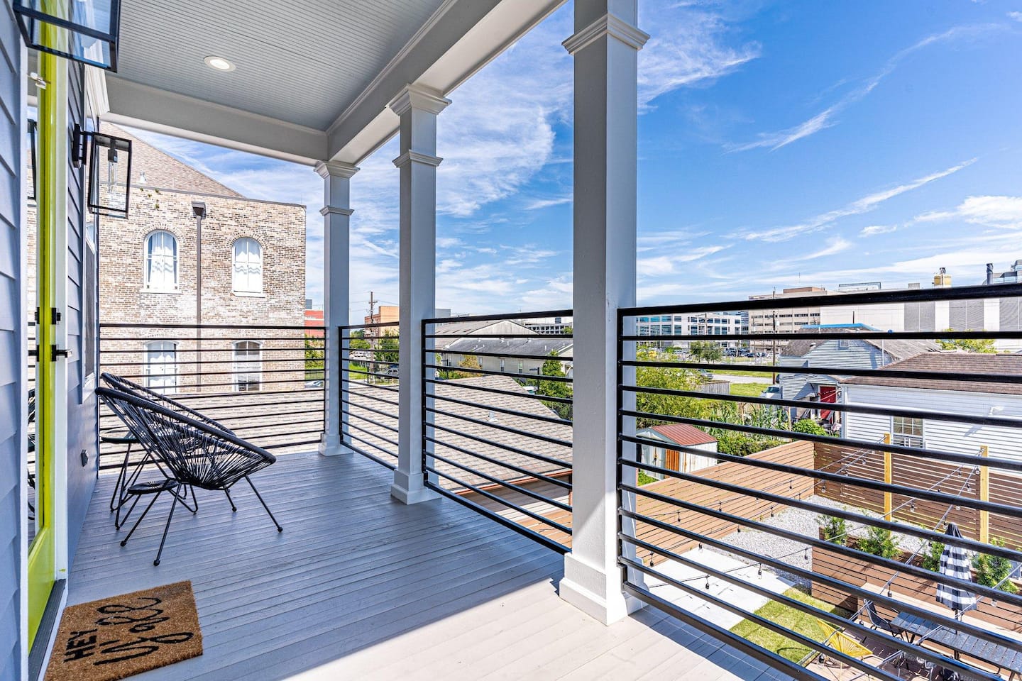 Covered balcony with view of downtown, the Superdome, and neighboring historic buildings!