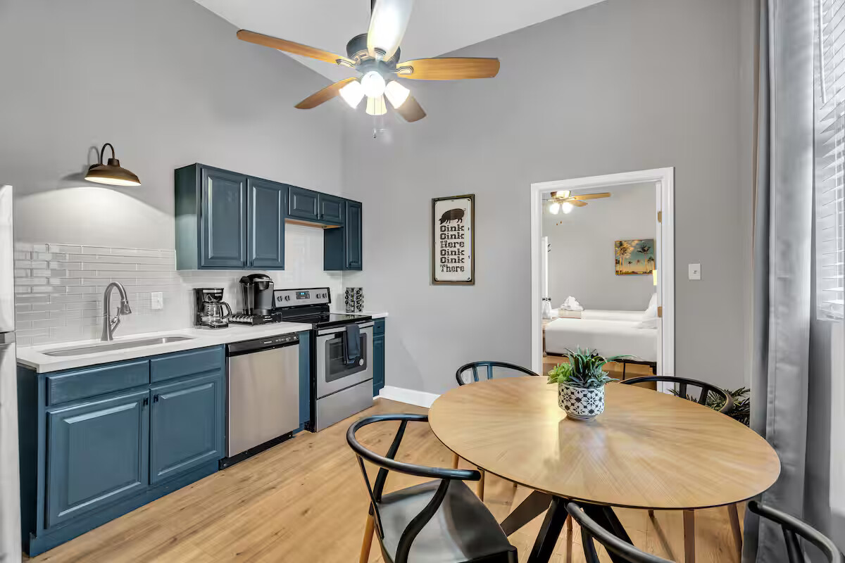 The kitchen is sleek and fully stocked, featuring modern appliances, cookware, and plenty of space to prep meals or enjoy a quick bite. Ready for anything from morning coffee to a full dinner spread!