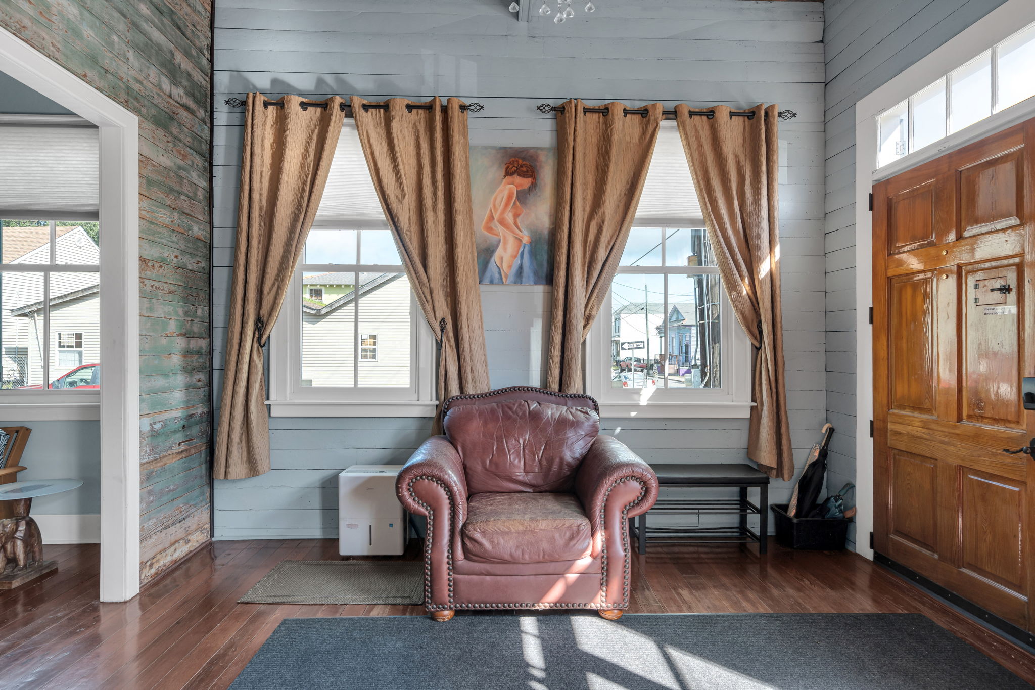 Charming corner with plush leather chair and sunny views