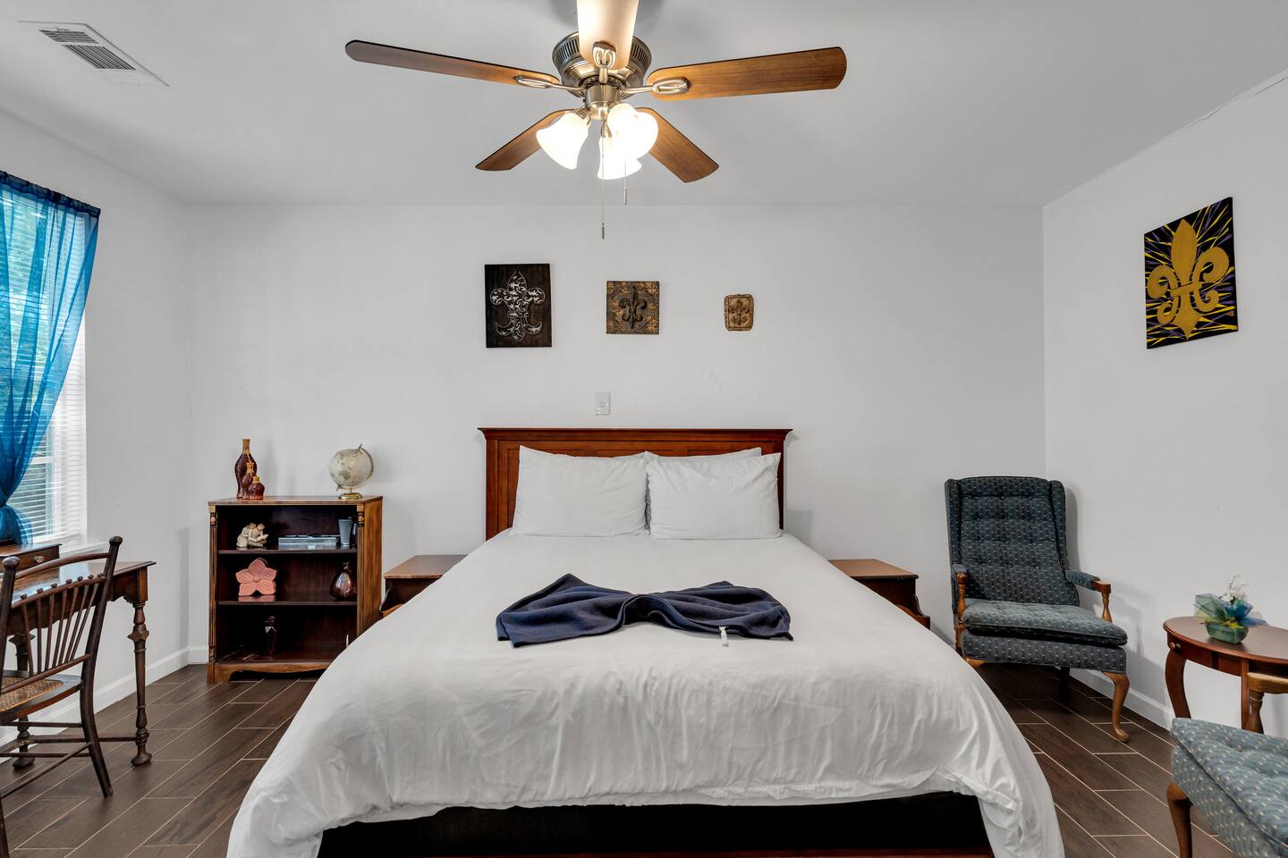 Cozy queen bed with soft lighting and charm