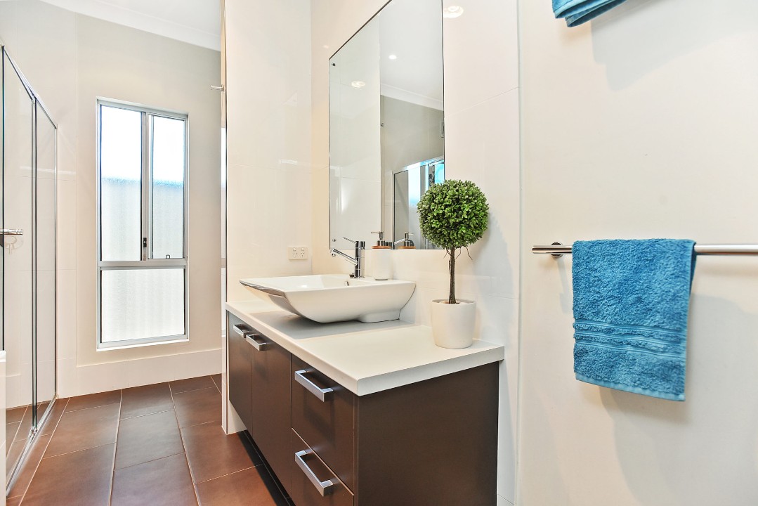 Premium Bathrooms. Ensuite with double vanities and rainfall shower, main bath with soaking tub and floor-to-ceiling tiles. Additional powder room/toilet for guests’ convenience