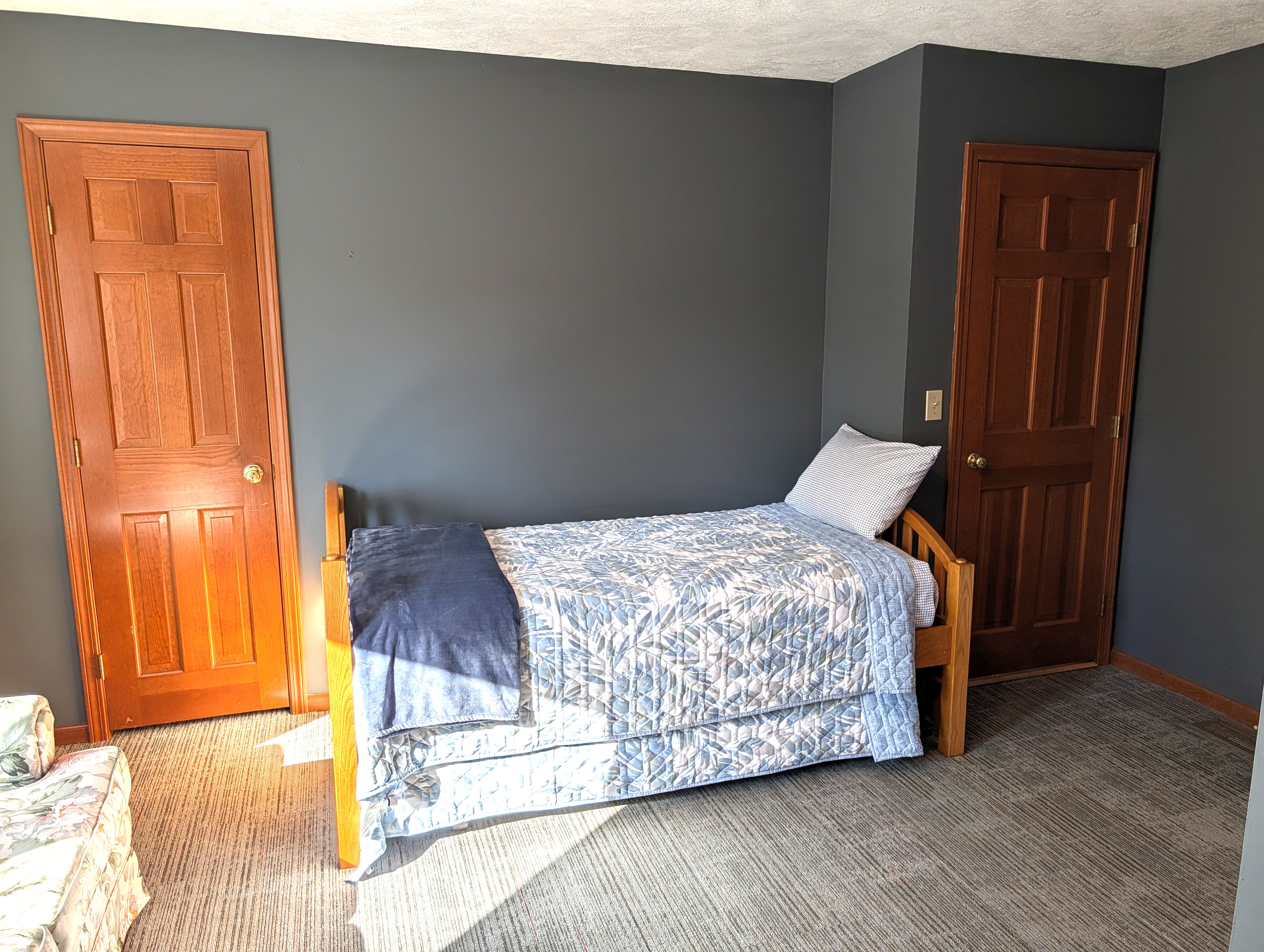 BEDROOM #5 (SECOND FLOOR):  Mixed-use bedroom on the second floor with a trundle bed, loveseat, and a washer and dryer.