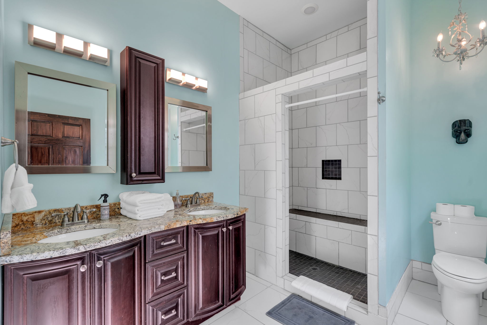 Spacious bathroom with walk-in shower and elegant vanity