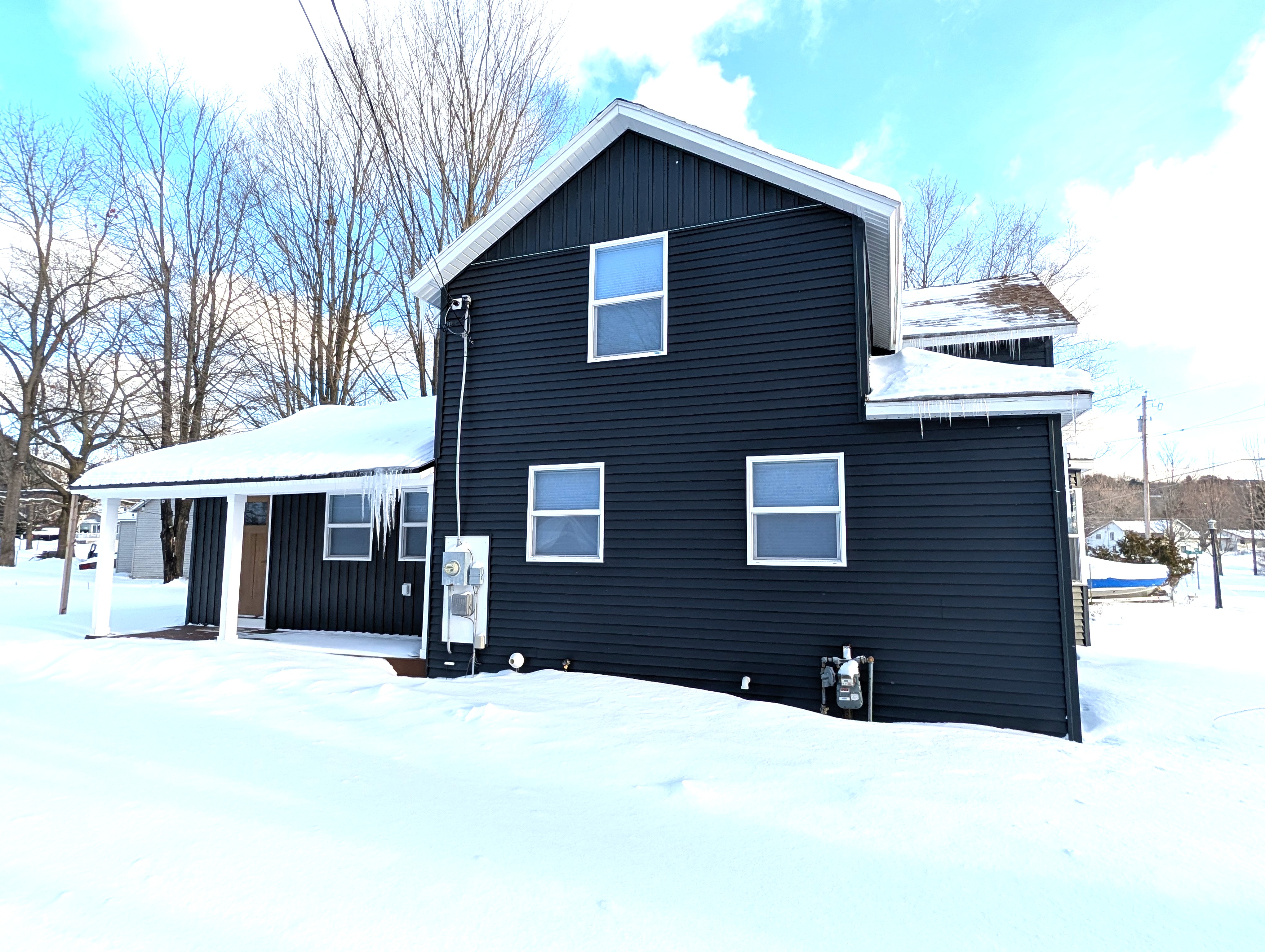 EXTERIOR:  The side of the house in Winter