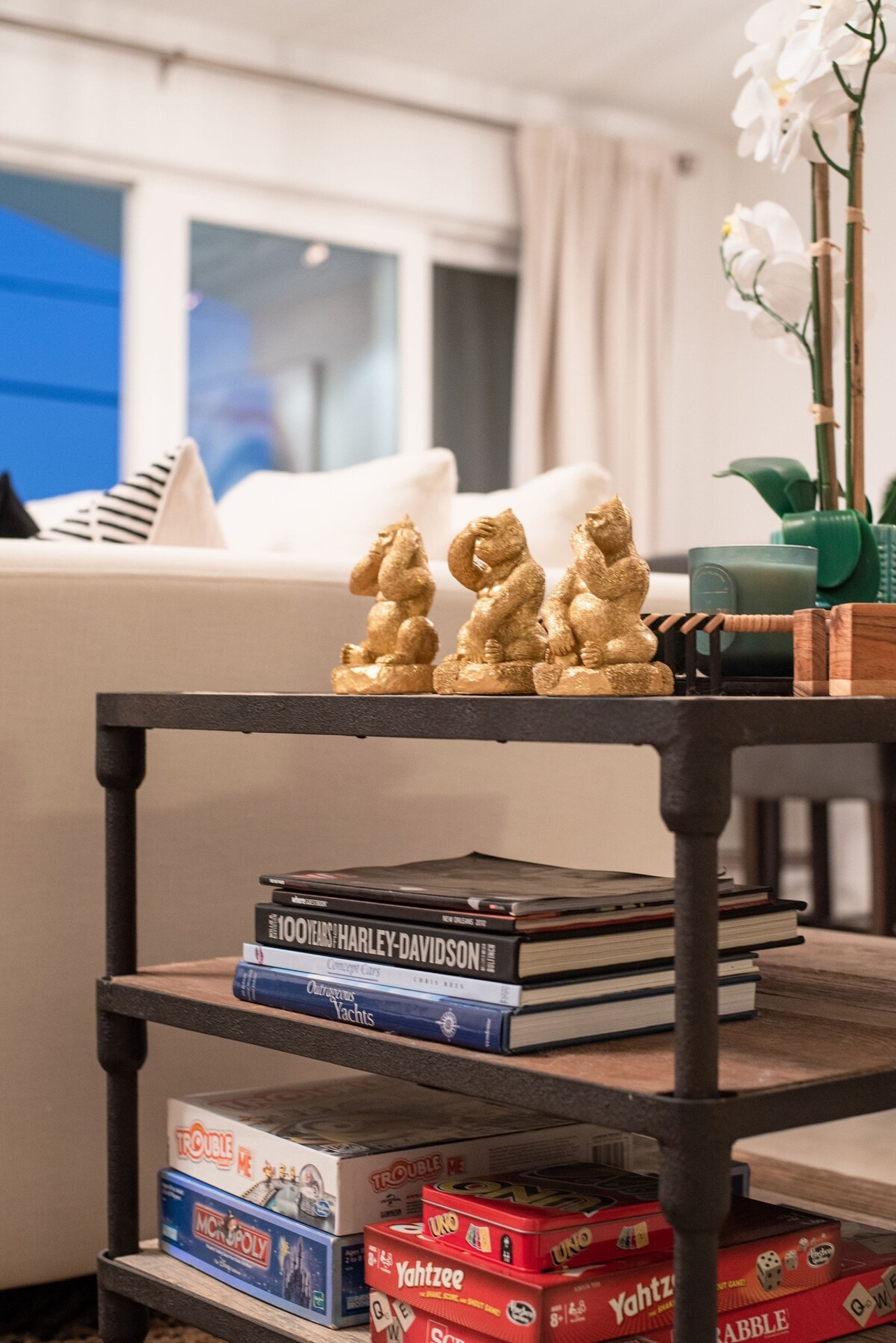 Living room featuring two large sofas, a chaise, dining for 10 at the table, and a full service wet bar.