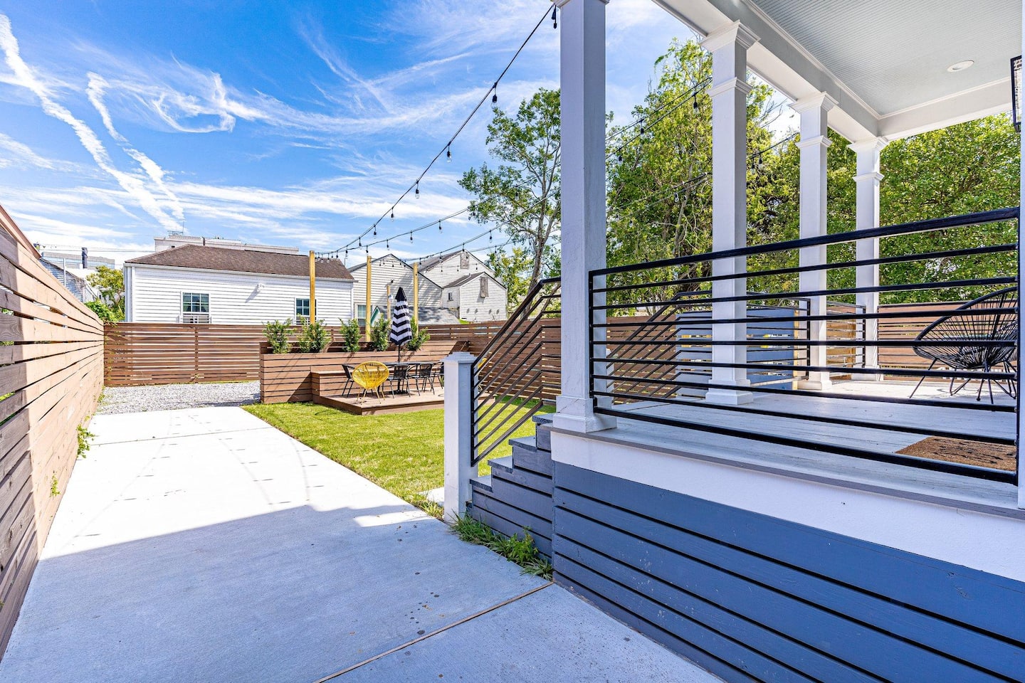 Seating on the covered rear porch and a spacious backyard with a deck and seating for 10! But wait, there's more!