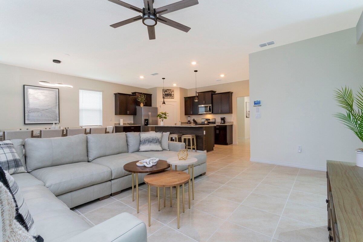 Welcome to our spacious and beautifully adorned living room, complete with a state-of-the-art smart TV where you can stream all your favorite channels and shows. 