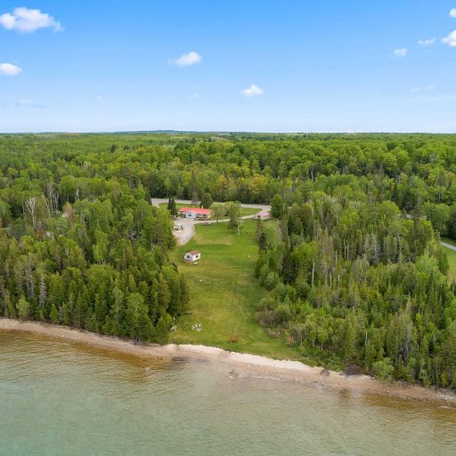 Aerial view of the shoreline and surrounding Northern Michigan landscape.