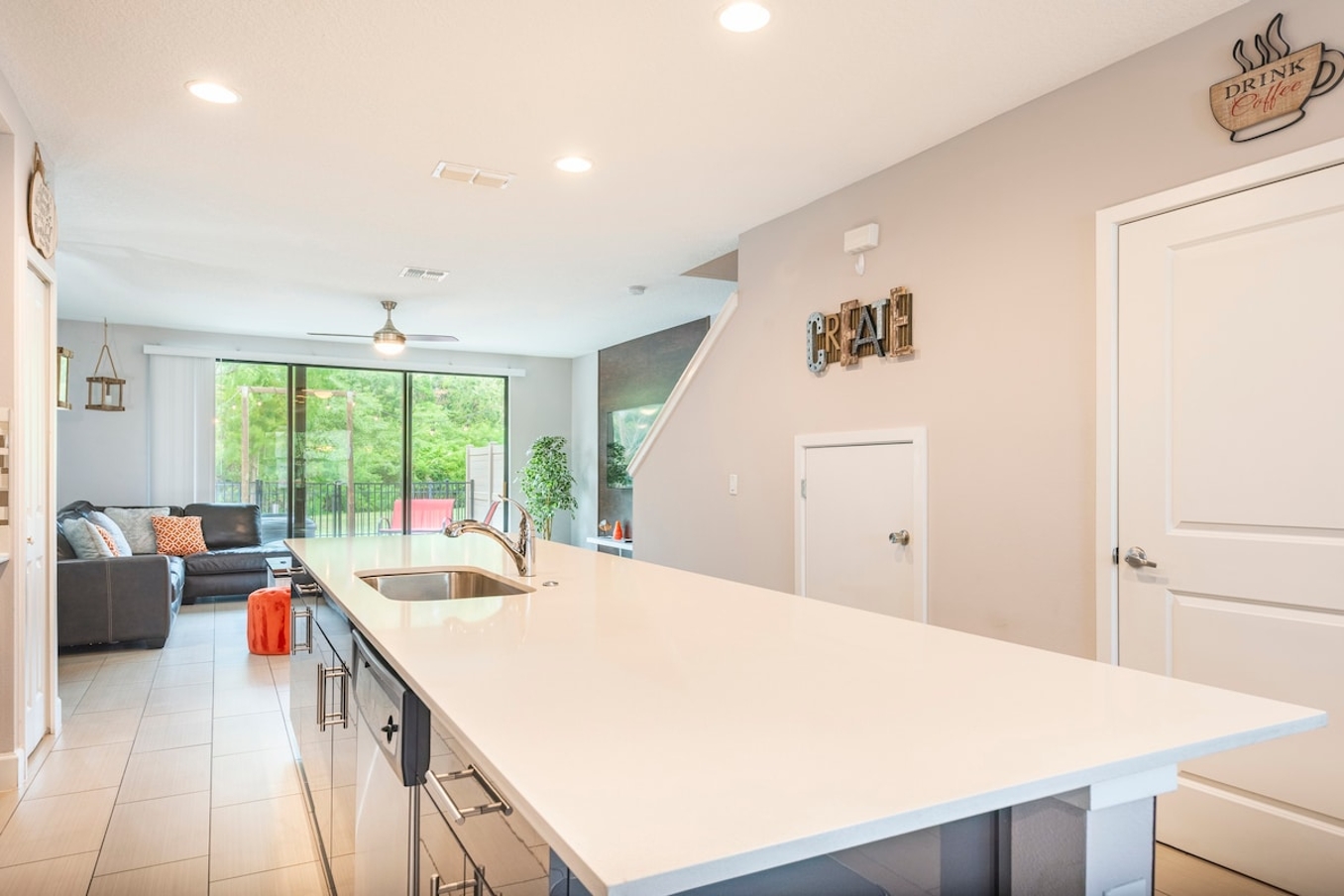 Open living space that seamlessly connects the beautiful kitchen and dining area, offering a perfect blend of comfort and style.