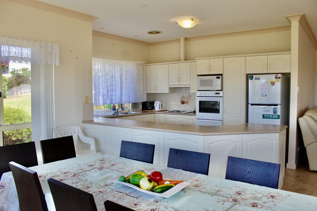 Fully equipped kitchen plus two patios and BBQ setup, empowering guests to control dining costs and preferences.