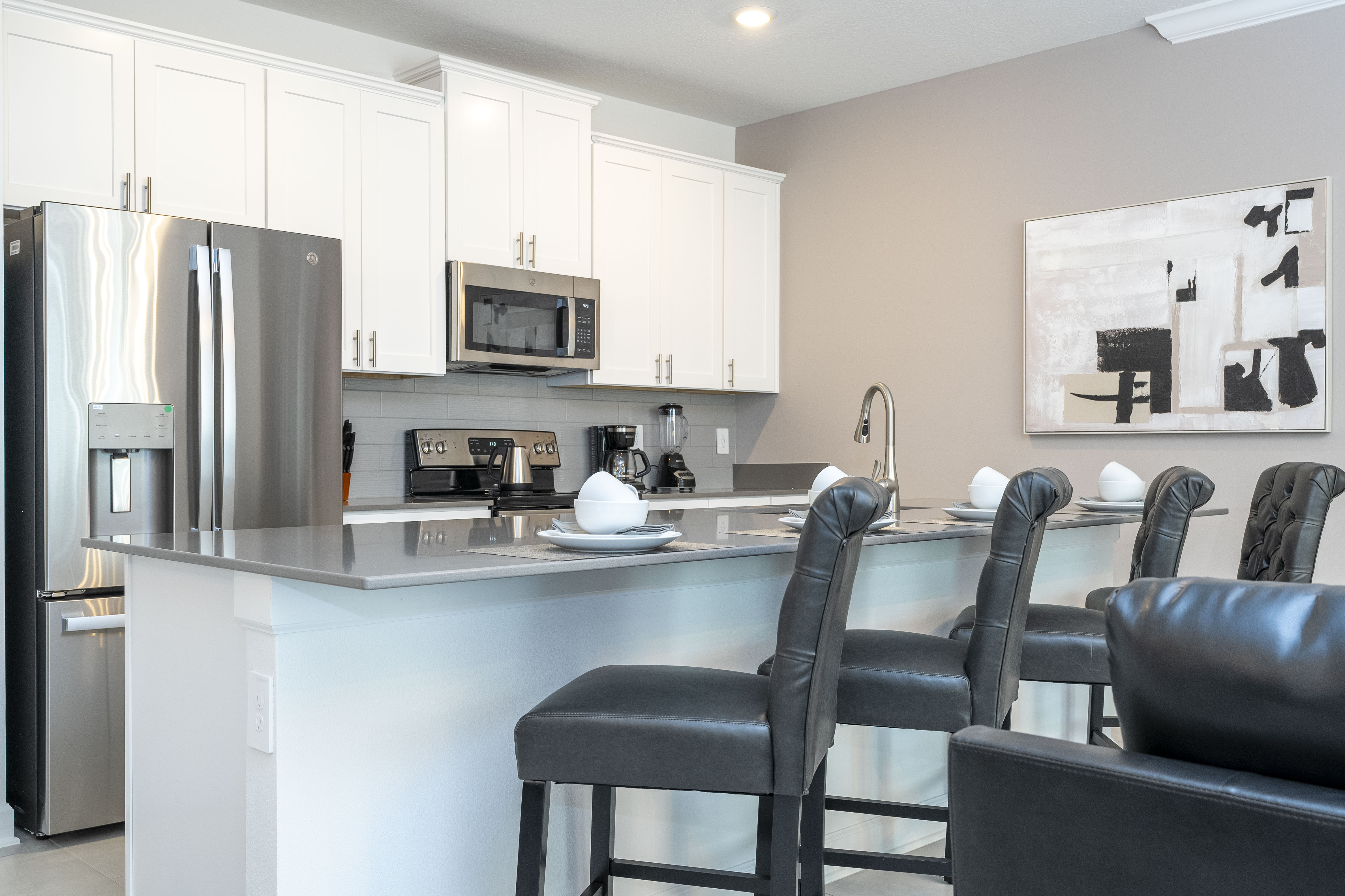 This exquisite, spacious kitchen, where beauty and vibrancy come together in perfect harmony. Picture yourself savoring morning coffee by the sunlit bay window, or whipping up a feast on the expansive granite countertops.