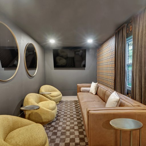 Lounge with a TV and comfortable seating for movie nights.