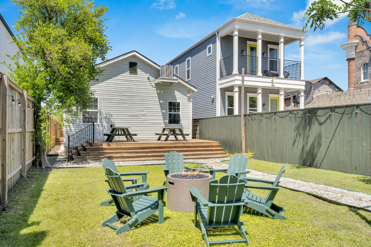 Perfect backyard hangout—fire pit, seating, and sunny NOLA skies.