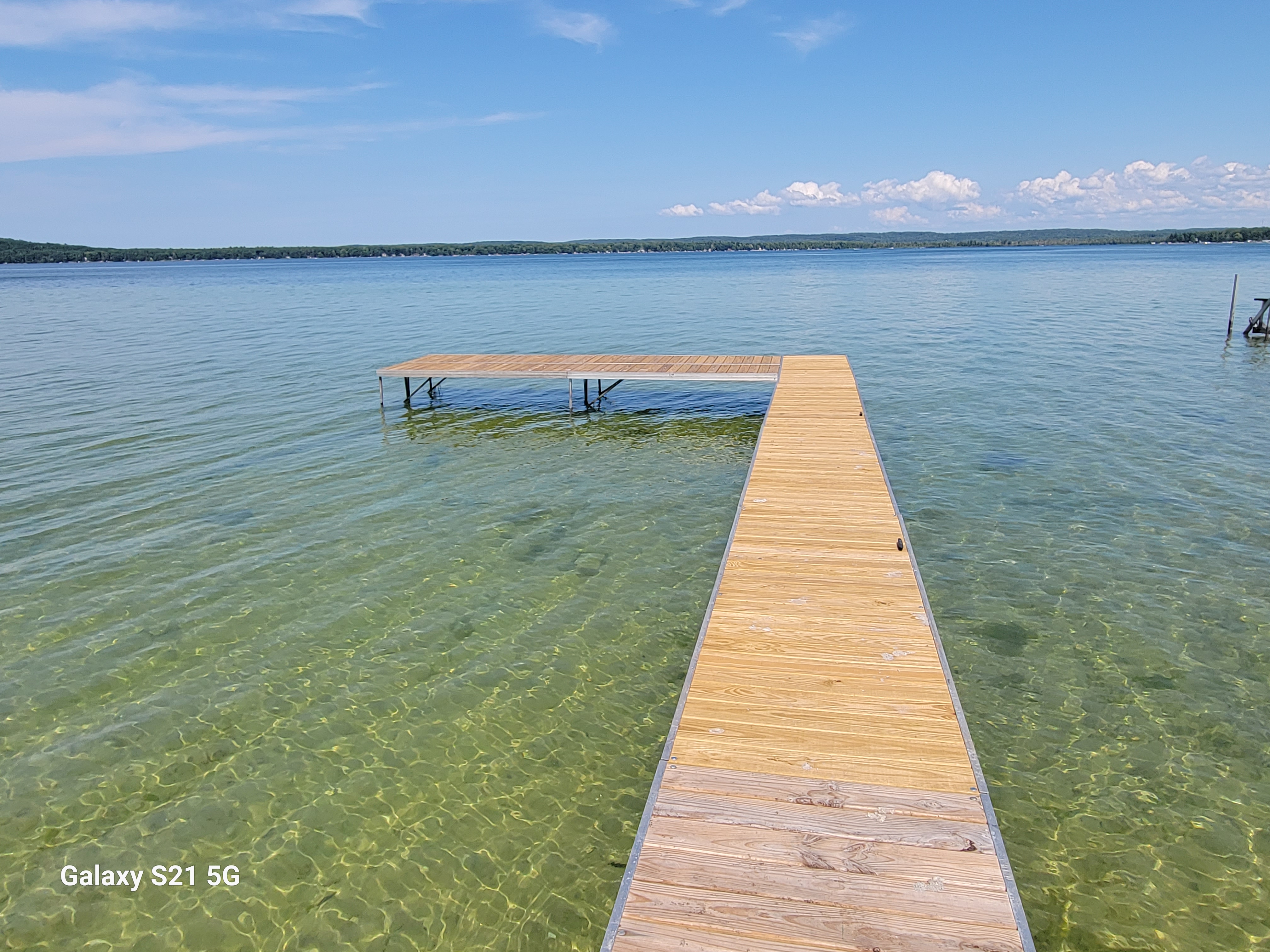 OVERVIEW:  The home includes a fantastic private dock on Big Platte Lake!