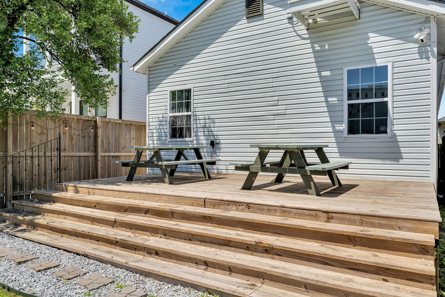 Catch some sun or enjoy a meal on the backyard deck.