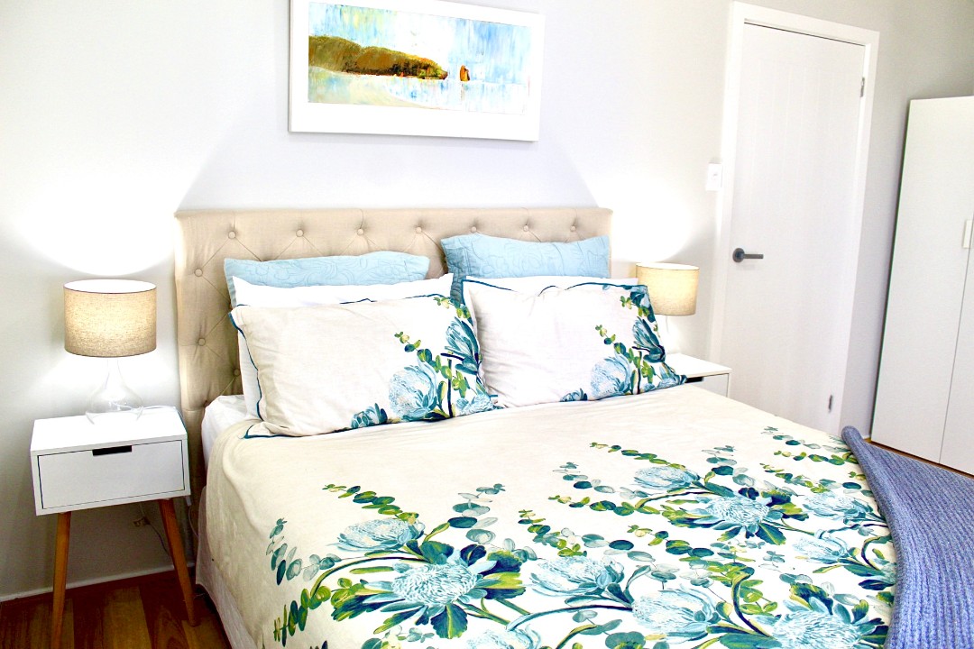 Flexible four-bedroom layout, including a second living area with a sofa bed and deck access