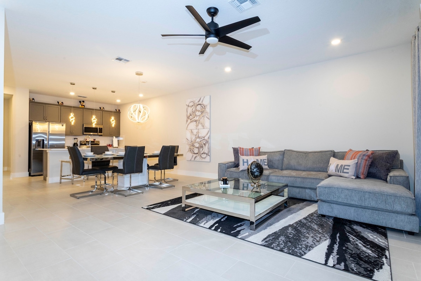 Open living space that seamlessly connects the beautiful kitchen and dining area, offering a perfect blend of comfort and style.