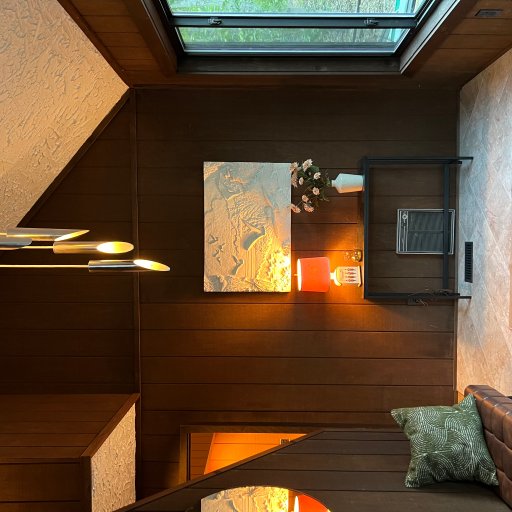 Welcoming entry way with warm wood tones and lighting