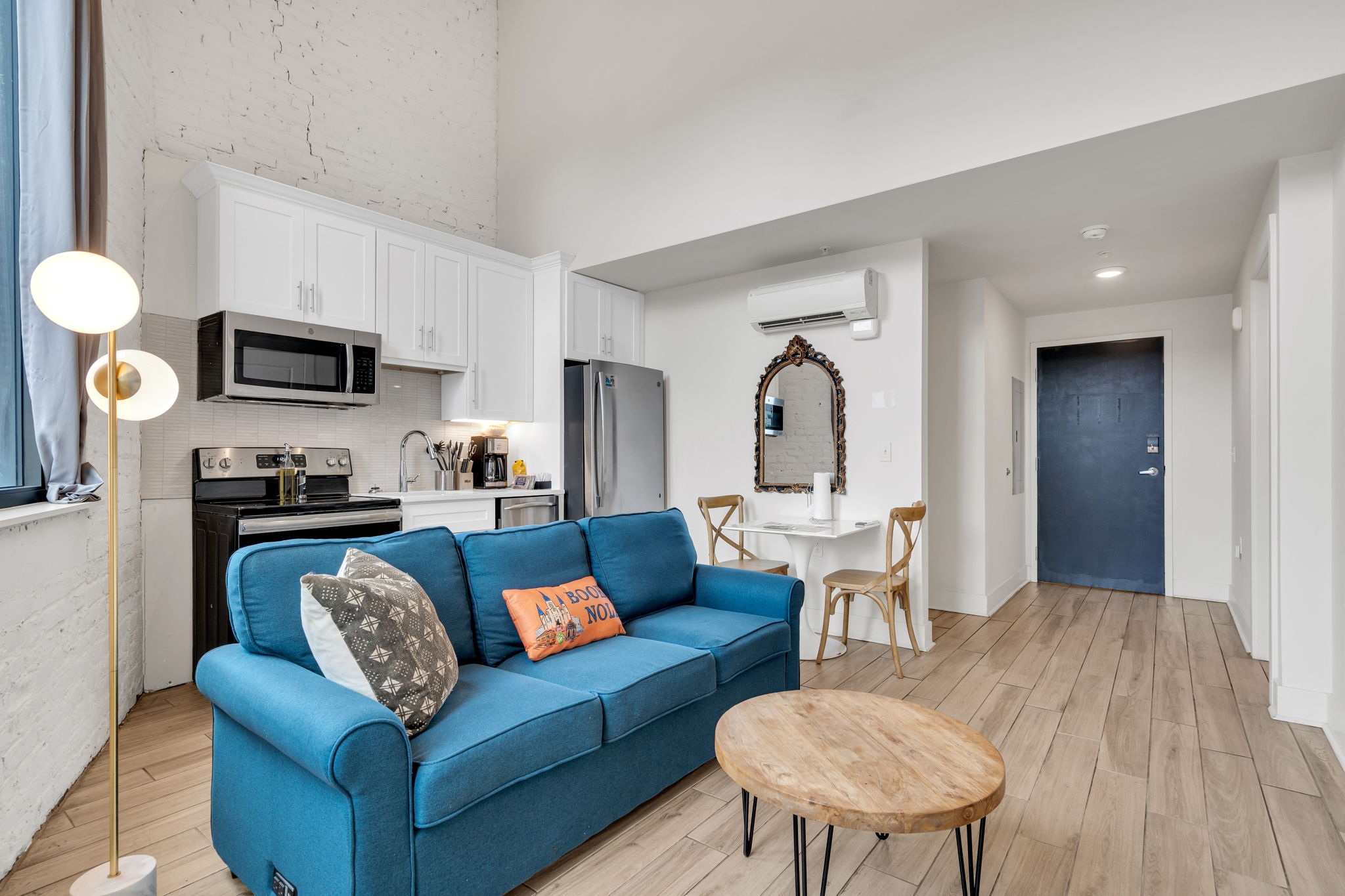 Kick back in a soulful living room with high ceilings, classic architectural touches, and the spirit of New Orleans just outside your window (Unit 1)