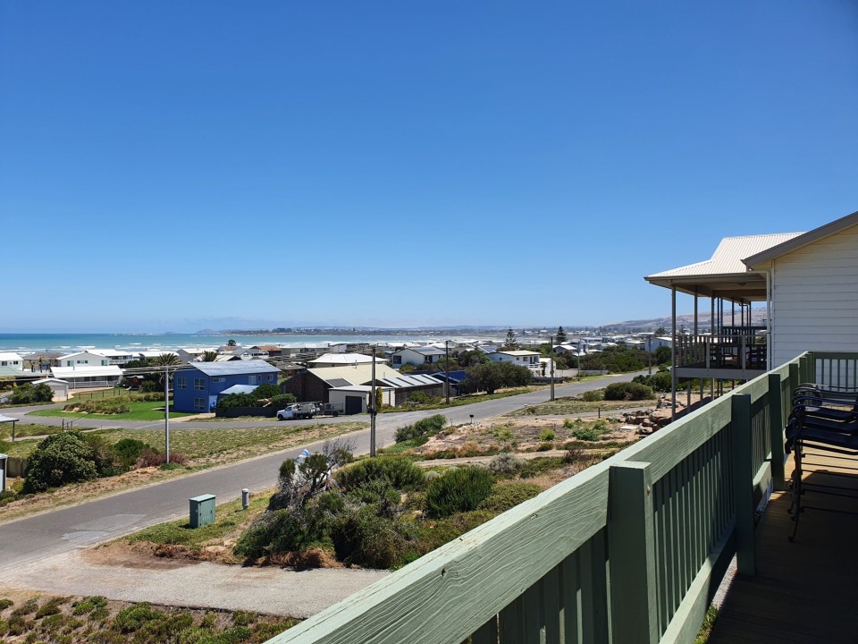 Upper-level deck with sweeping views ideal for sunrise coffees, sunset drinks, and alfresco lounging