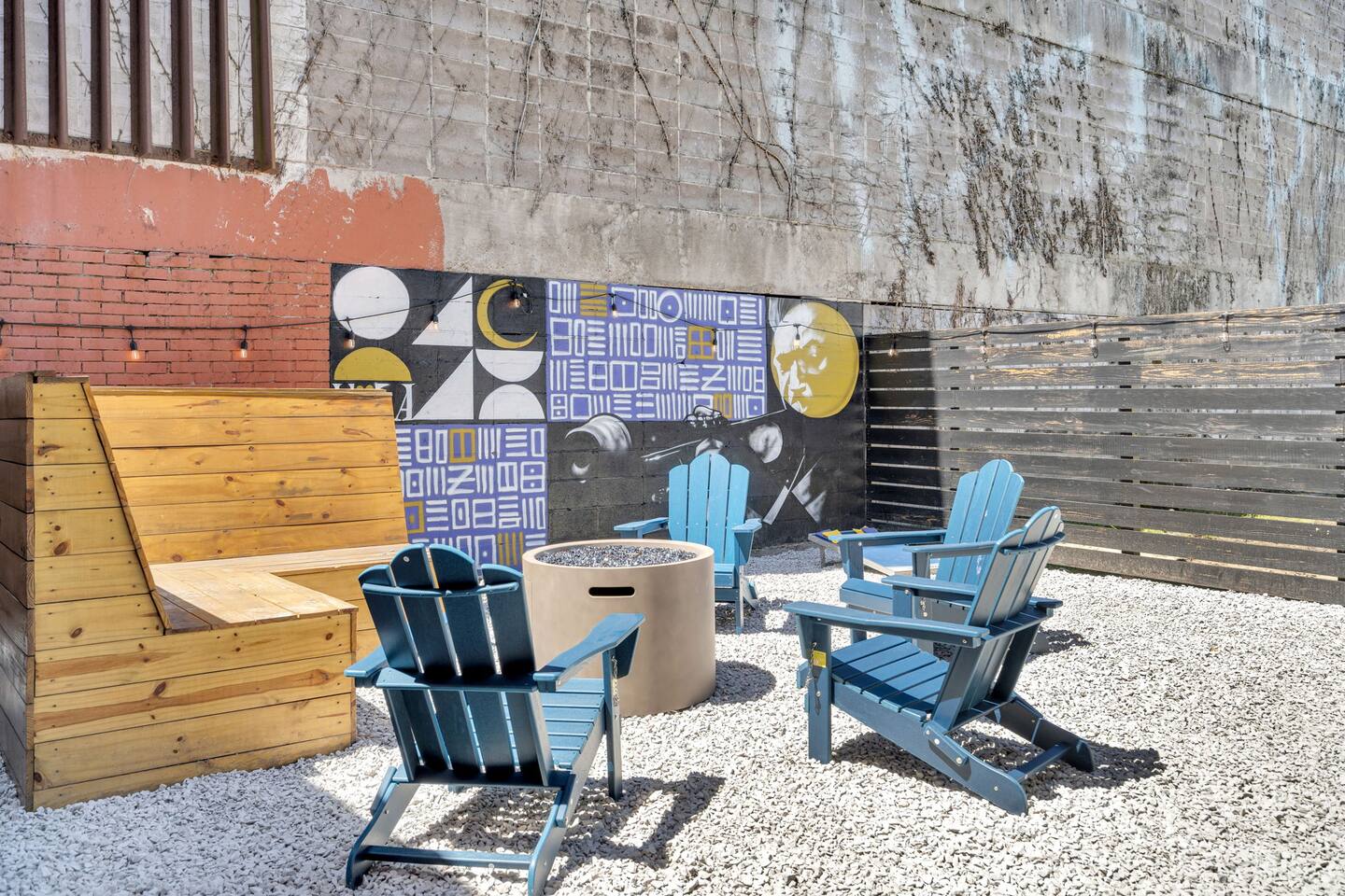 Urban courtyard with fire pit and local art—your outdoor chill zone.