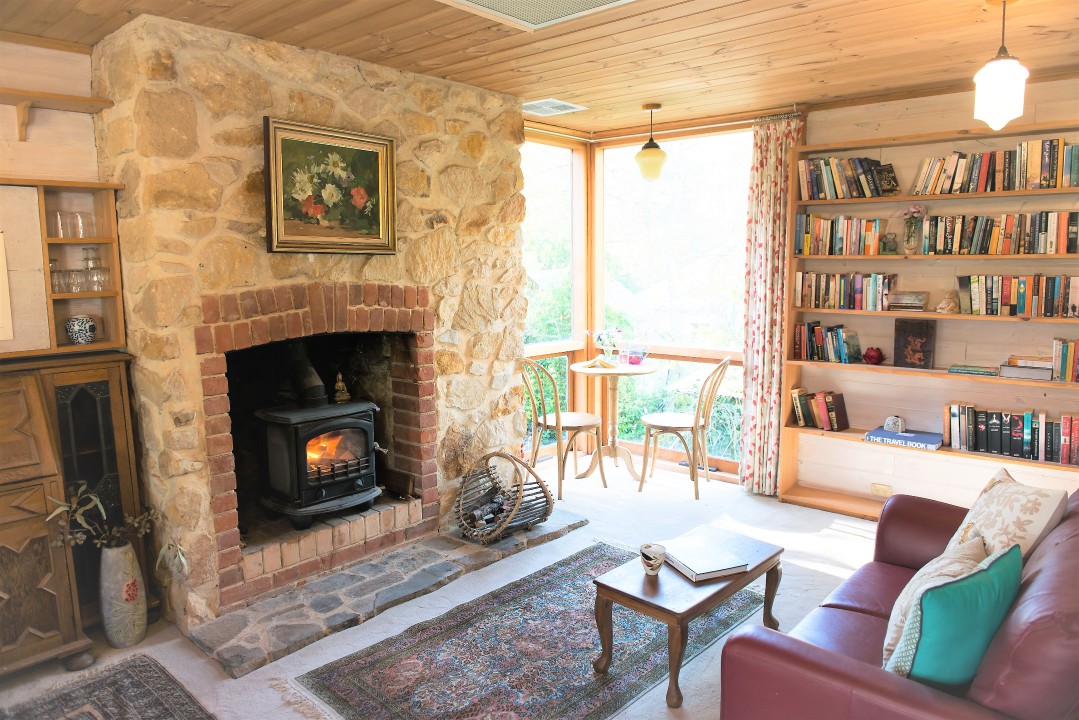 Situated above the original red gum cottage, surrounded by camellias and rhododendrons, providing private natural setting