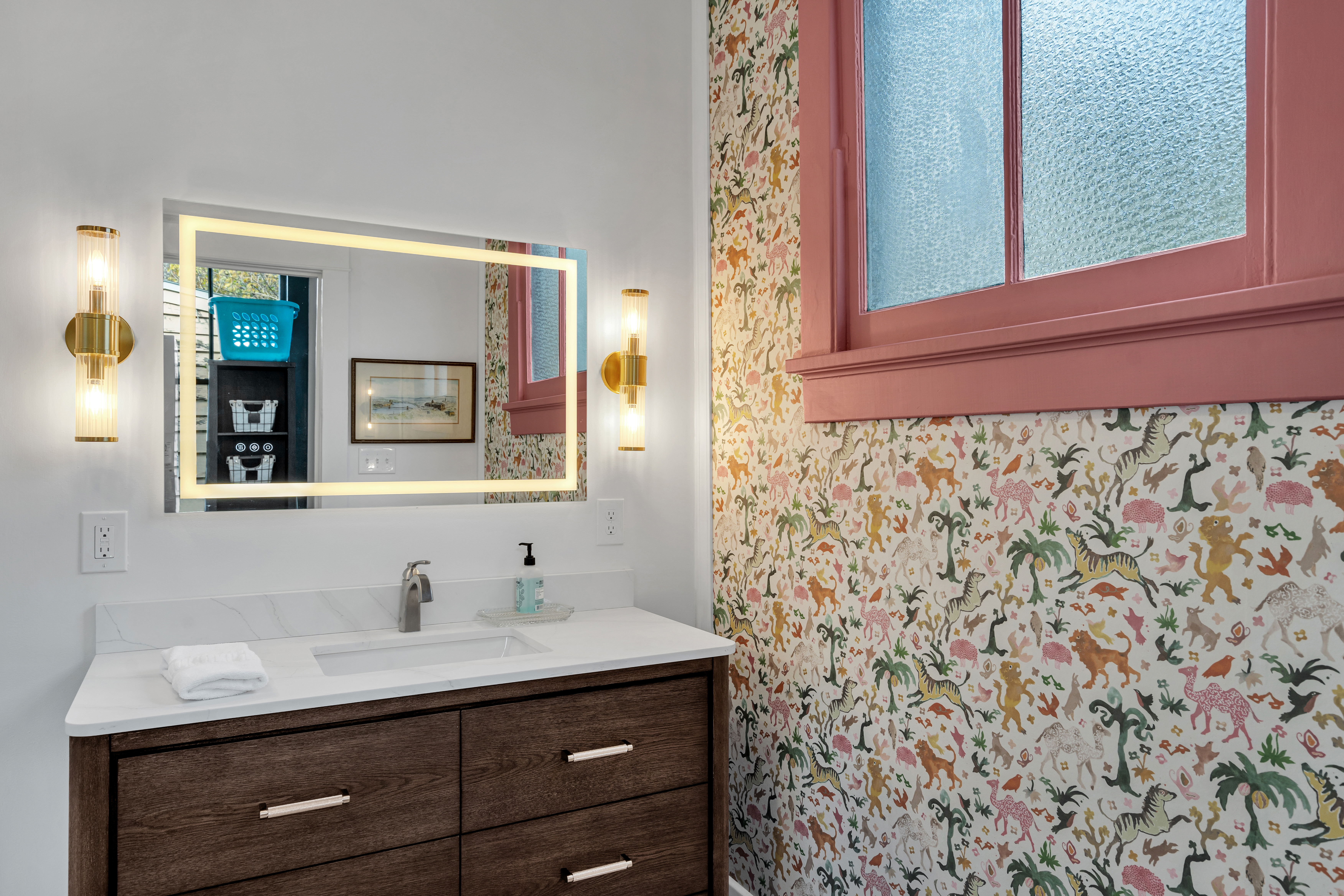 Bathroom vanity with floral wallpaper accents