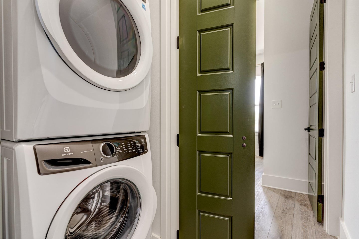 Convenient laundry room before our favorite bathroom and upstairs master bedroom!