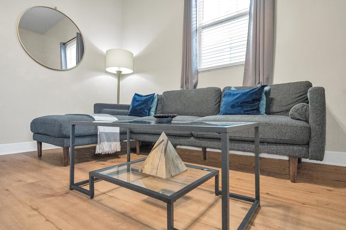 The living room is warm and welcoming, with comfy seating