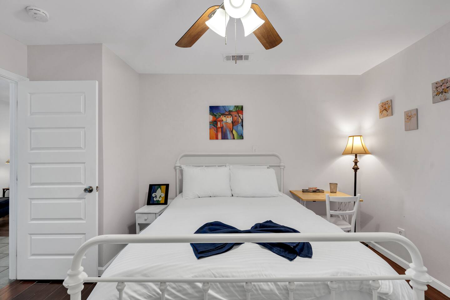 Serene bedroom with soft lighting and art décor